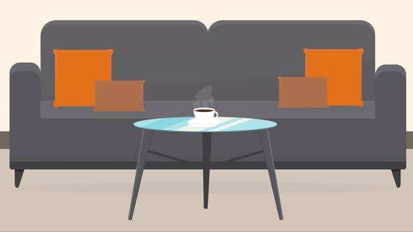 coffee stands on the table near the sofa with steam