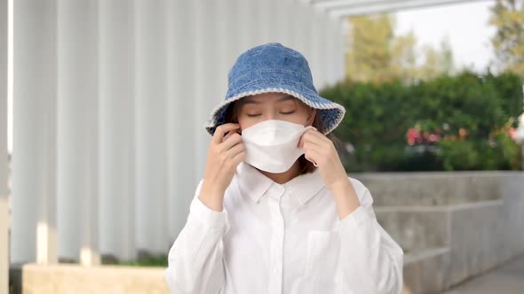 Asian women wearing masks in public