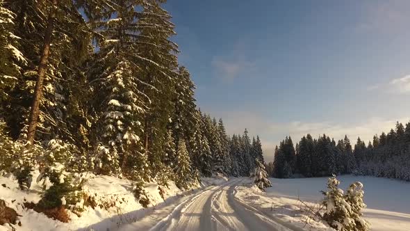 Road in Mountain with Forest and Snow and Ice Scenic