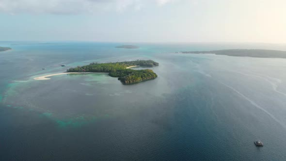 Aerial: uncontaminated coastline tropical beach caribbean sea at Pasir Panjang K alt