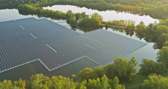 Aerial Top View of Electric Power Industry Solar Panels on Floating in Lake Water Renewable Energy alt