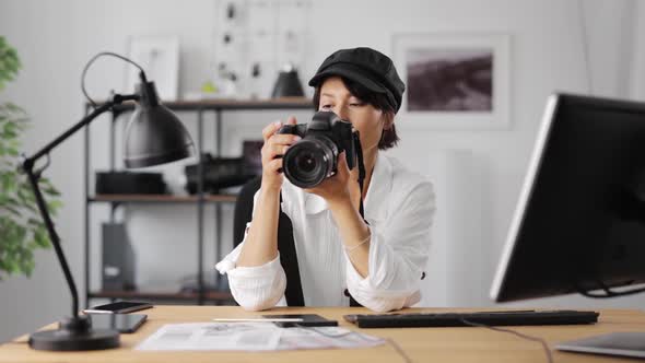 Female Photographer Setting Up Camera