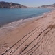 Seashore of Alanya city after heavy storm. Dirt polluted beach with tree debris and plastic garbage - VideoHive Item for Sale