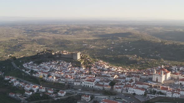 Aerial drone view of Castelo de Vide in Alentejo, Portugal from Serra de Sao Mamede mountains alt