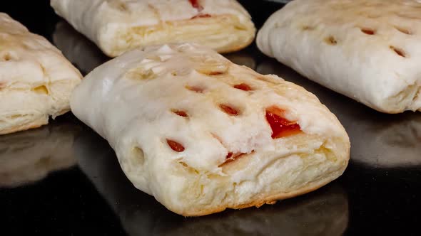Timelapse Zoom Out  Four Buns with Red Strawberry Jam Baking in Electric Oven alt