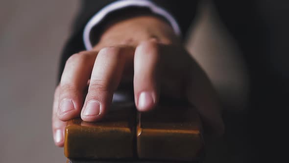 businessman hand taps armchair armrest by finger closeup alt