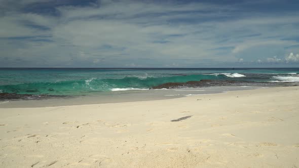 Waves Touching Reef and Sandy  Beach
