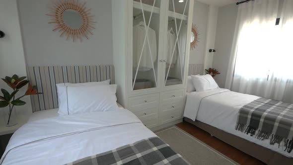 Stylish and Compact Bedroom Decoration With Two Single Beds alt