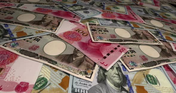Dollar Euro Yuan banknotes flying over money surface