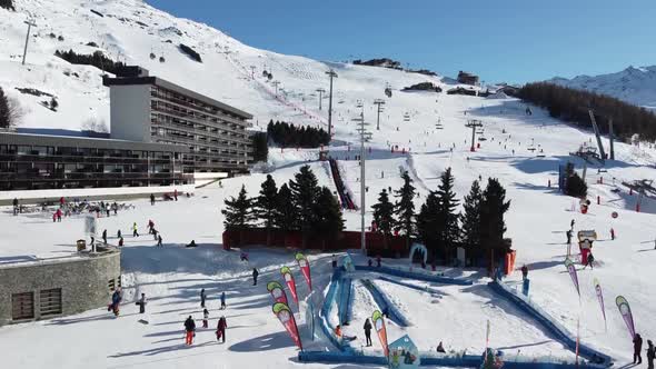 Majestic Winter Aerial Landscape and Ski Resort with Typical Alpine Wooden Houses in French Alps