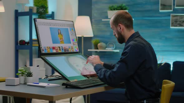 Man Photographer Retouching Pictures on Editing Software alt