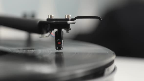 Needle and Arm on Spinning Vinyl Record Turntable Player alt