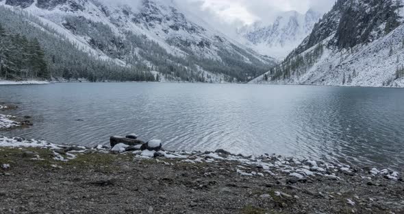 Snow Mountain Lake Timelapse at the Autumn Time. Wild Nature and Rural Mount Valley. Green Forest of alt