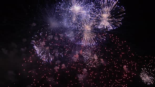 Colorful firework flashes at night