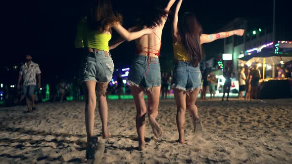 4K Group of Asian woman enjoy full moon beach party and dancing together. alt
