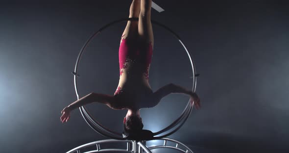 Upside Down Split While Doing a Headstand in a Spinning Hoop alt