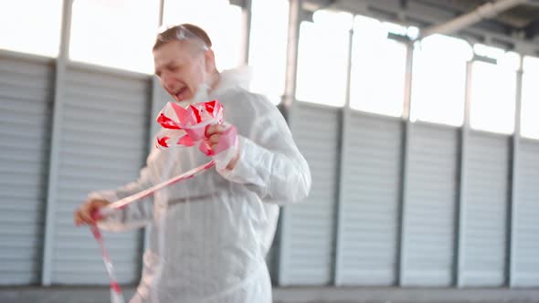 Man Wear White Protective Overall Takes Off the Protective Warning Tape Laughs Happy Because the alt