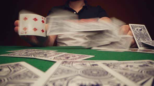 Close Up of Man Playing Card Game in Casino