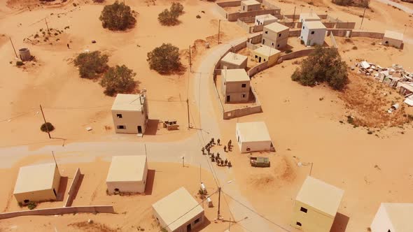aerial shot of soldiers training in an old empty city in the desert in palestine near Gaza at mornin alt