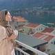 Woman Traditional Arab Dress Stands Terrace Enjoying Drinking Hot Coffee Tea Watching Views of - VideoHive Item for Sale