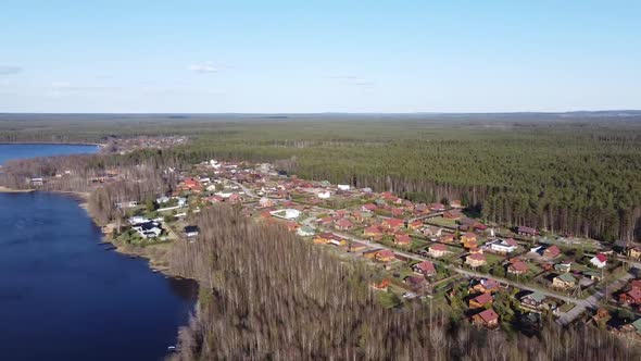 Aerial View of the Lake Borisovskoye, the Forest and the Settlement in Autumn Day, Borisovo