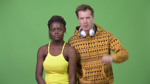 Young Multi-ethnic Couple Having Different Decisions alt