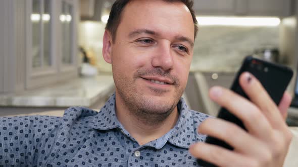 Guy Greeting and Talking By Video Conference Via Mobile Application alt