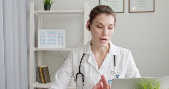 Doctor Talking To Patient Using Virtual Chat Computer App. Female Medical Therapist Wears Medical alt