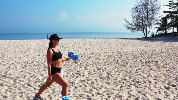 Girls tanning on tranquil island beach wildlife by shallow ocean and white sand background of Koh Ph alt