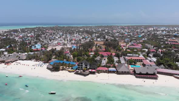Aerial Paradise Sandy Beach with Turquoise Ocean and Luxury Hotels in Zanzibar alt