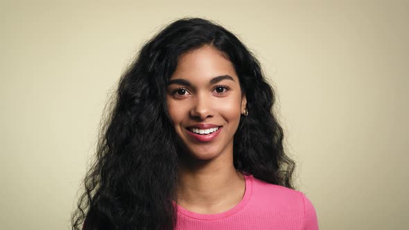 Close up video of playful young African woman. Shot with RED helium camera in 8K. alt