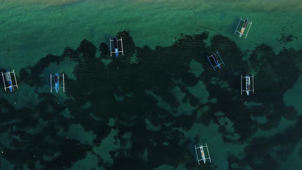 Fisherman boats parked near to the beach alt