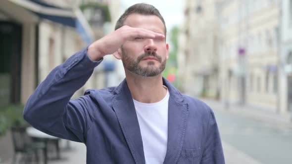 Outdoor Portrait of Man Looking Around Searching alt
