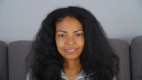 Beautiful black woman posing with cheerful smile for stock video alt