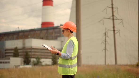 Electric Engineer Checking Power Voltage In Network Circuit Breaker.Power Electric Line alt