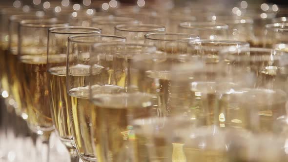 Row of Champagne Glasses with Poured Alcohol. Wine Glass at Party Banquet. Concept Nobody