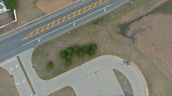 Middle of the Day on School Buses Parked Near the High School alt