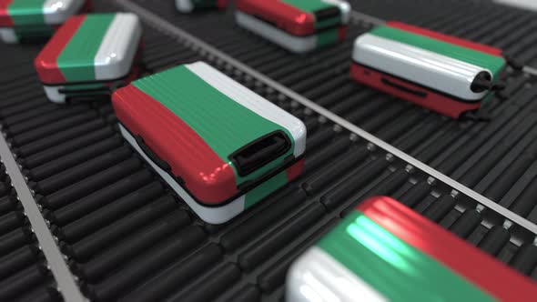 Many Travel Suitcases with Flag of Bulgaria on Conveyer alt