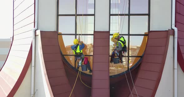Men Washing Windows at Height Modern Skyscraper alt