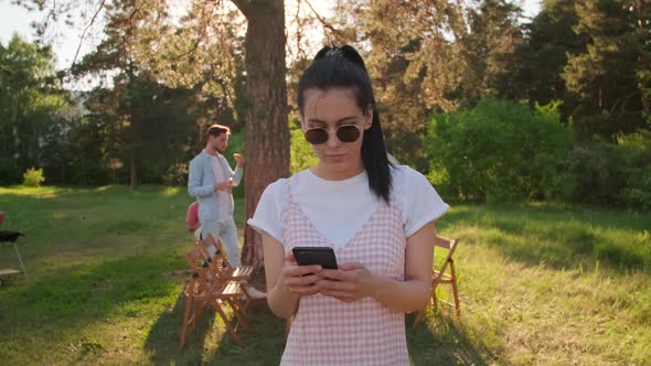 Woman Using Smartphone alt