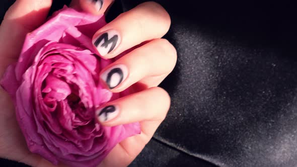 AMOR Word on Nails Manicure Hold Pink Rose Flower on Black Silk Fabric alt