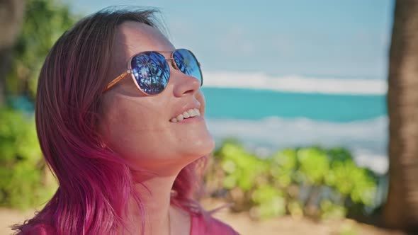 Close Up Portrait of Woman with Pink Hair Aviator Sunglasses Beautiful Smile alt
