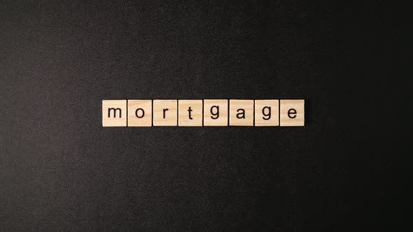 Wooden Cubes Open And Sets Up A Word Mortgage