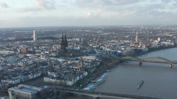 Aerial Descending Shot of Cityscape at Sunset alt