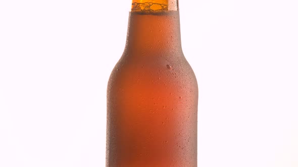 beer bottle rotating on white background alt