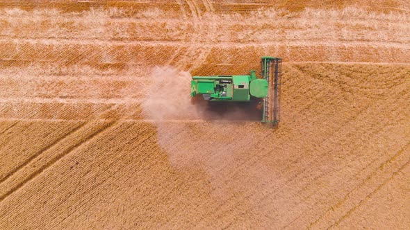  Impressive Flight Over a Working Combine Harvesting Tons of Ripe Barley alt