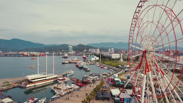 Beautiful Scenic Drone Shot of Ferris Wheel and Port in Batumi City Georgia Europe alt