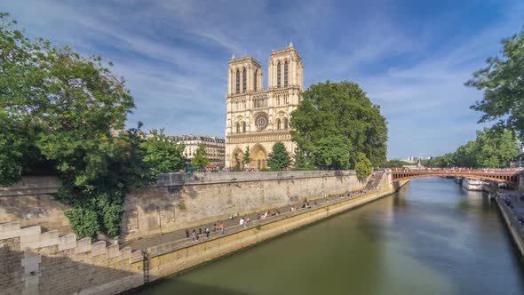Front Facade of Cathedral of Notre Dame De Paris, with Square Full of People in Front Timelapse alt