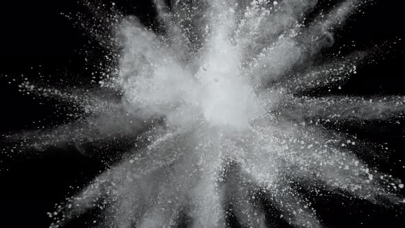 Super Slowmotion Shot of White Powder Explosion Isolated on Black Background alt