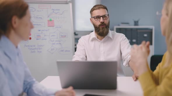 Experienced Workers Discussing Business